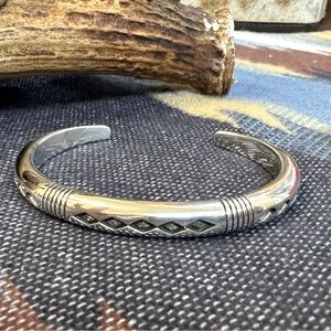 Charles Ortiz Navajo artisan of San Felipe Pueblo.Sterling silver cuff bracelet